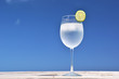 Glass of water on the tropical beach