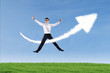 Photo: Businessman jumping and give thumbs up over success sign Businessman jumping and give thumbs up over success sign