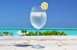 Glass of water on the tropical beach