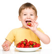Photo: Happy little boy with strawberries Happy little boy with strawberries