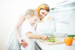 Happy mother and son cooking