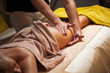 Beautiful young woman enjoys massage