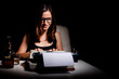 Novelist writing a book on a typewriter