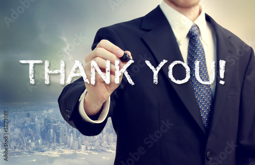 Photo: Business man drawing THANK YOU Business man drawing THANK YOU