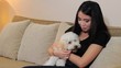 Pretty Asian Woman Gives Her Dog A Tasty Treat