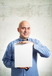 Photo: Businessman holding paper Businessman holding paper
