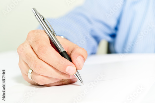 Photo: Businessman signing contract Businessman signing contract