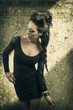 fashion portrait of beauty brunette in old background