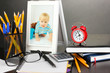 Photo: White photo frame on office desk on grey background White photo frame on office desk on grey background