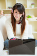 young asian woman using laptop