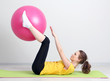 Photo: Portrait of beautiful young woman exercises with gym ball Portrait of beautiful young woman exercises with gym ball