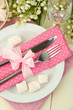 Table setting in white and pink tones