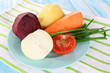 Peeled vegetables on plate on napkin