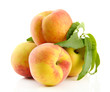 Ripe sweet peaches with leaves, isolated on white