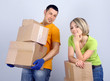 Photo: Young couple moving in new house Young couple moving in new house