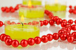 Lighted candles with beads close up