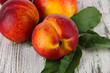Photo: Peaches on wooden table Peaches on wooden table