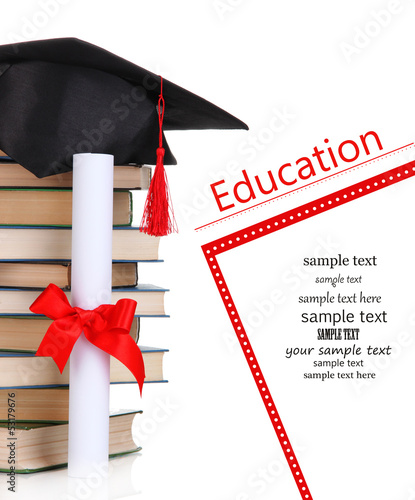 Photo: Grad hat with diploma and books isolated on white Grad hat with diploma and books isolated on white
