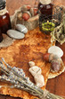 Composition with old papers, herbs, stones and bottles with