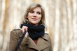 Photo: Happy blond woman in autumn forest Happy blond woman in autumn forest