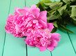 Beautiful peonies on table close-up