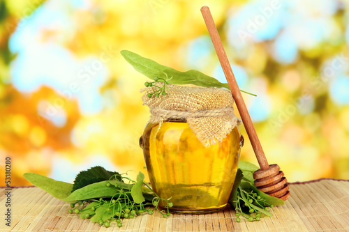 Photo: Jar of honey with flowers of lime, Jar of honey with flowers of lime,