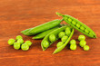 Sweet green peas on wooden background