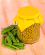 Green peas on wooden background