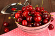 Photo: Ripe red cherry berries in bowl and chocolate sauce Ripe red cherry berries in bowl and chocolate sauce
