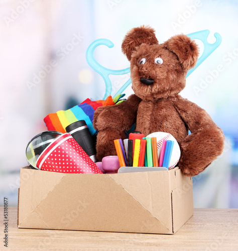 Photo: Personal property in carton on table in room Personal property in carton on table in room