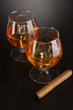 Foto: Brandy glasses with ice on wooden background Brandy glasses with ice on wooden background