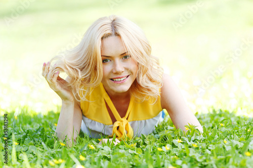 Photo: Woman lying on grass Woman lying on grass
