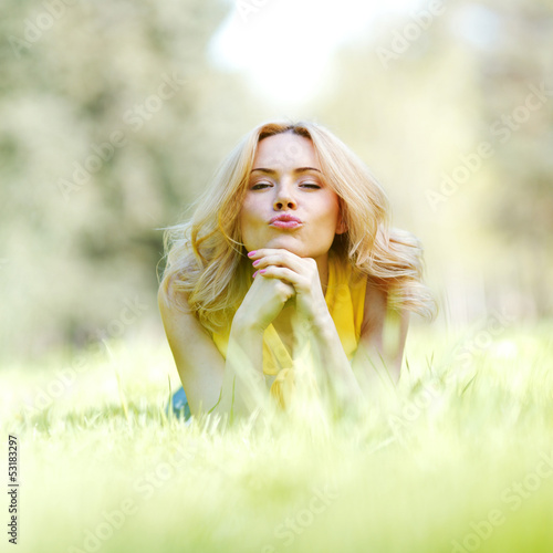 Photo: Woman lying on grass Woman lying on grass