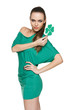 Woman wearing green dress showing green shamrock leaf