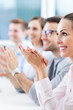 Business team clapping in meeting