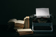 Old typewriter with books retro colors on the desk