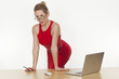 Seductive businesswoman wearing a red dress