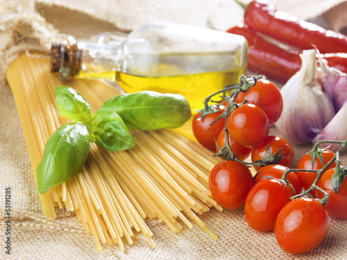 Photo: pasta spaghetti vegetables, spices and oil pasta spaghetti vegetables, spices and oil