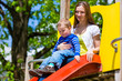 Family - Mother and son playing on a jungle gym