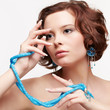 woman with teal beads
