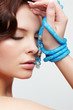 woman with teal beads