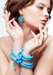 woman with teal beads
