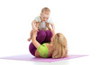 mother with baby doing gymnastics and fitness exercises