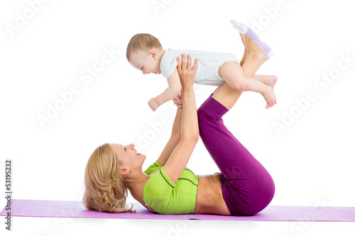 Photo: mother with baby doing gymnastics and fitness exercises mother with baby doing gymnastics and fitness exercises