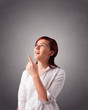 Young woman standing and thinking with copy space