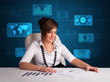 Photo: Businesswoman doing paperwork with digital background Businesswoman doing paperwork with digital background