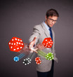 Foto: Attractive man throwing dices and chips Attractive man throwing dices and chips