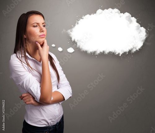 Photo: Pretty lady thinking about cloud speech or thought bubble with c Pretty lady thinking about cloud speech or thought bubble with c