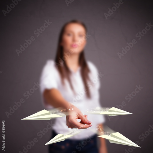 Photo: Beautiful lady throwing origami airplanes Beautiful lady throwing origami airplanes