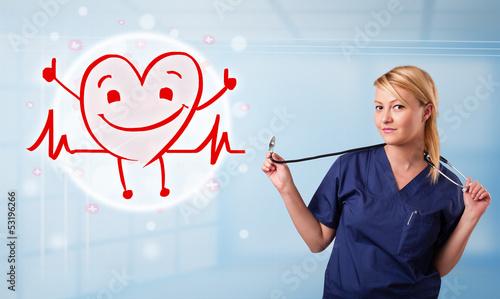 Photo: Attractive doctor with happy red smiling heart Attractive doctor with happy red smiling heart